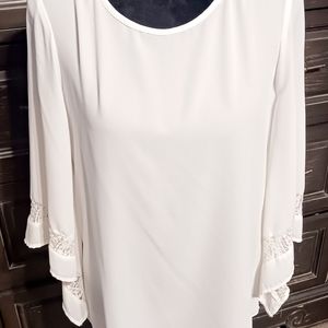 Beautiful white top with lace accents on arms. Size Small from Cato